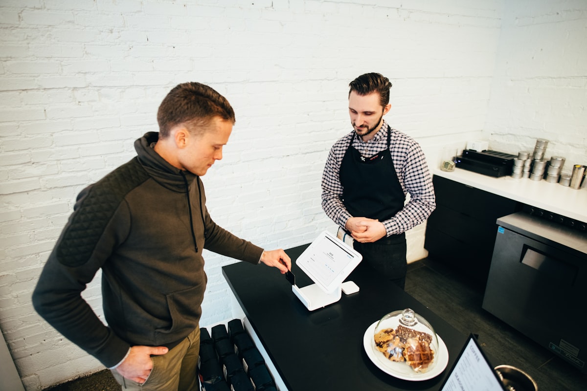 Stock image of a store associate helping a customer